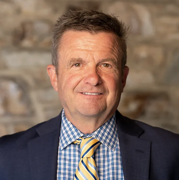smiling man in tie